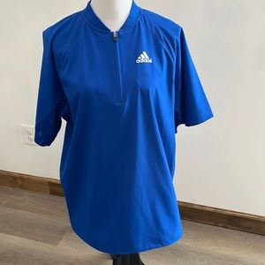 Adidas’s windbreaker. Measures 23 inches from armpit across.